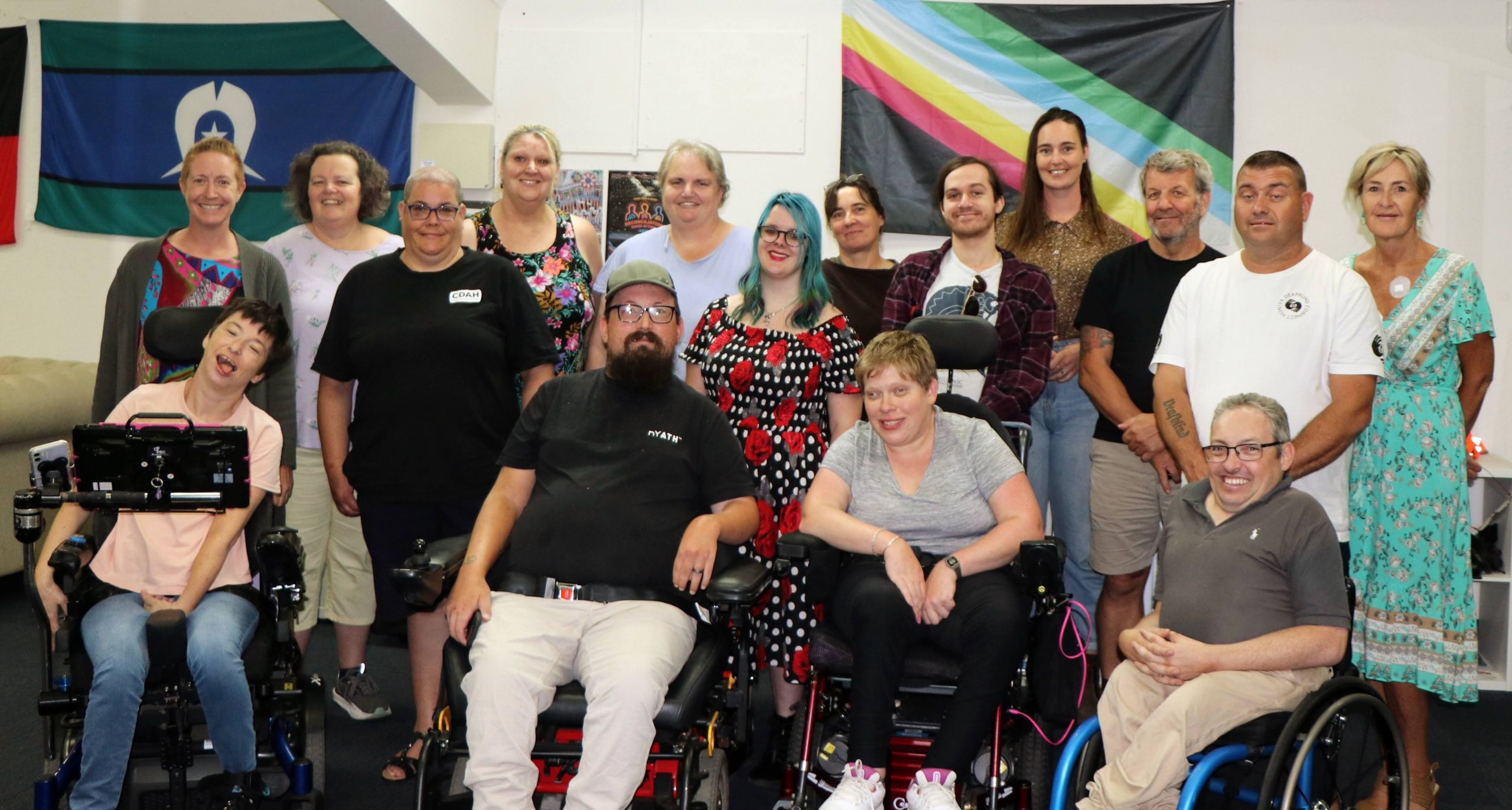 CDAH team in front disability pride flag