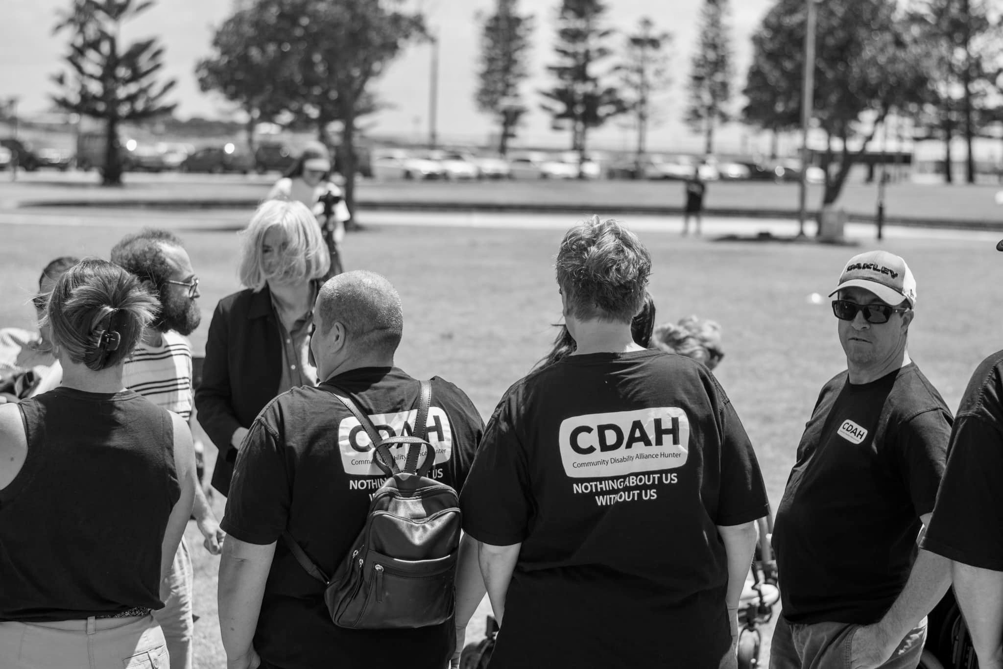 Black and white photo of wearing CDAH T Shirts
